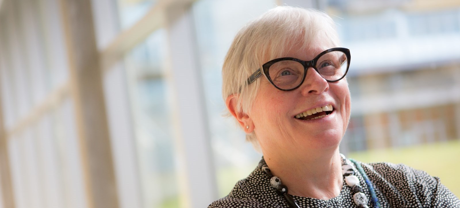 An older adult smiling