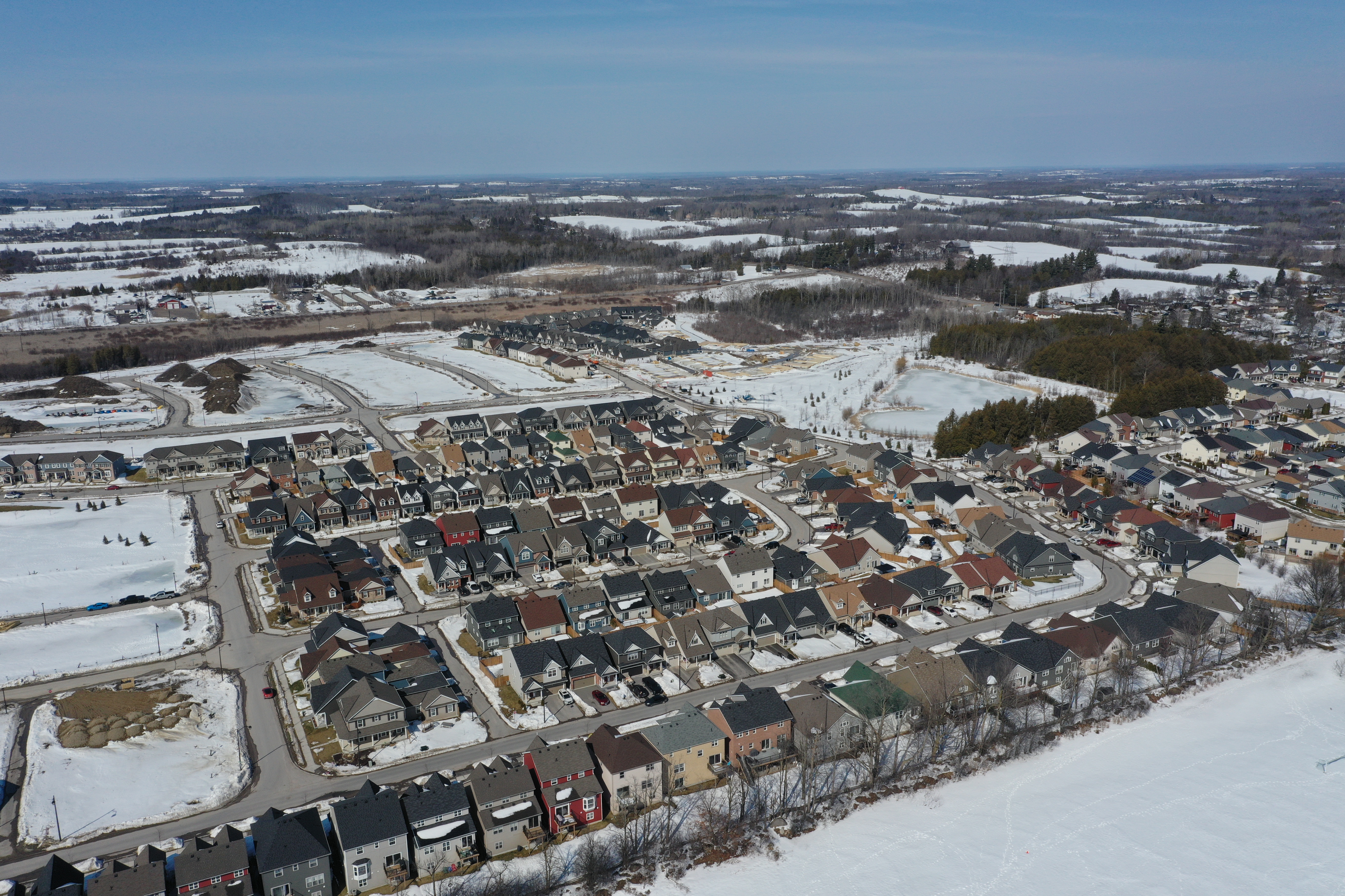 Aerial image of a residential neighbourhood with snow on the ground