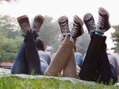 Teenagers in a field hanging out