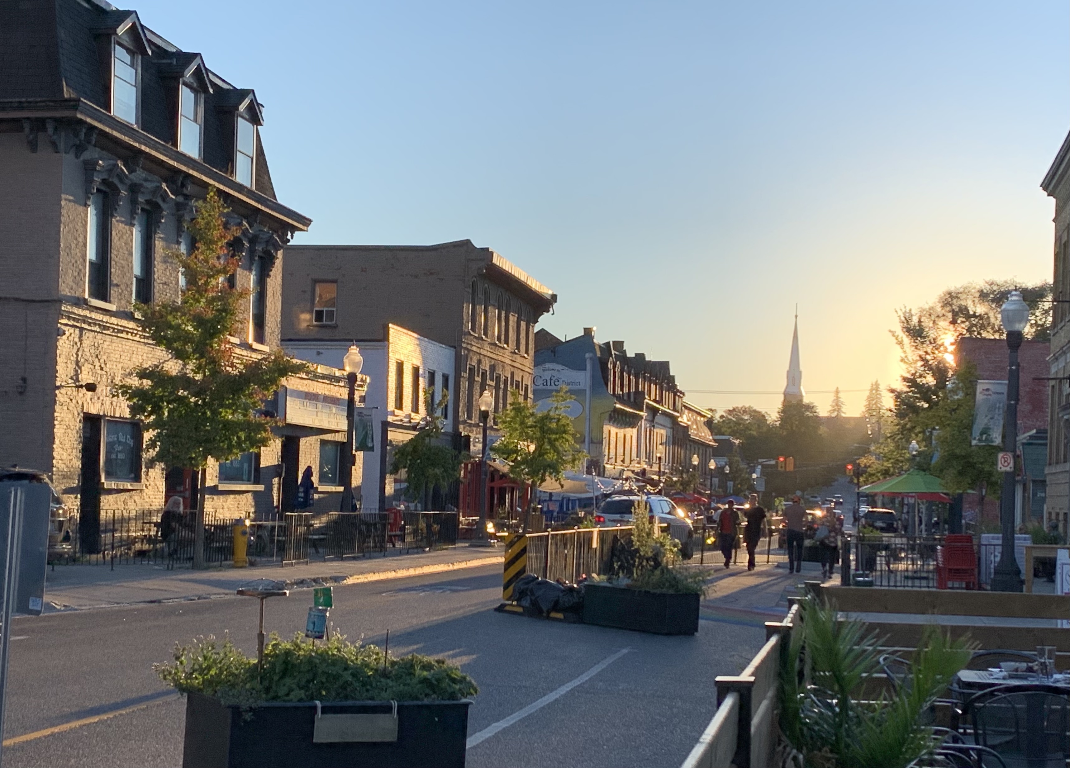 Patios along Hunter Street West at sunset