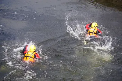 Two firefighters in water
