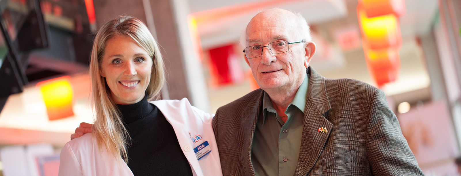 Two people standing next to each other