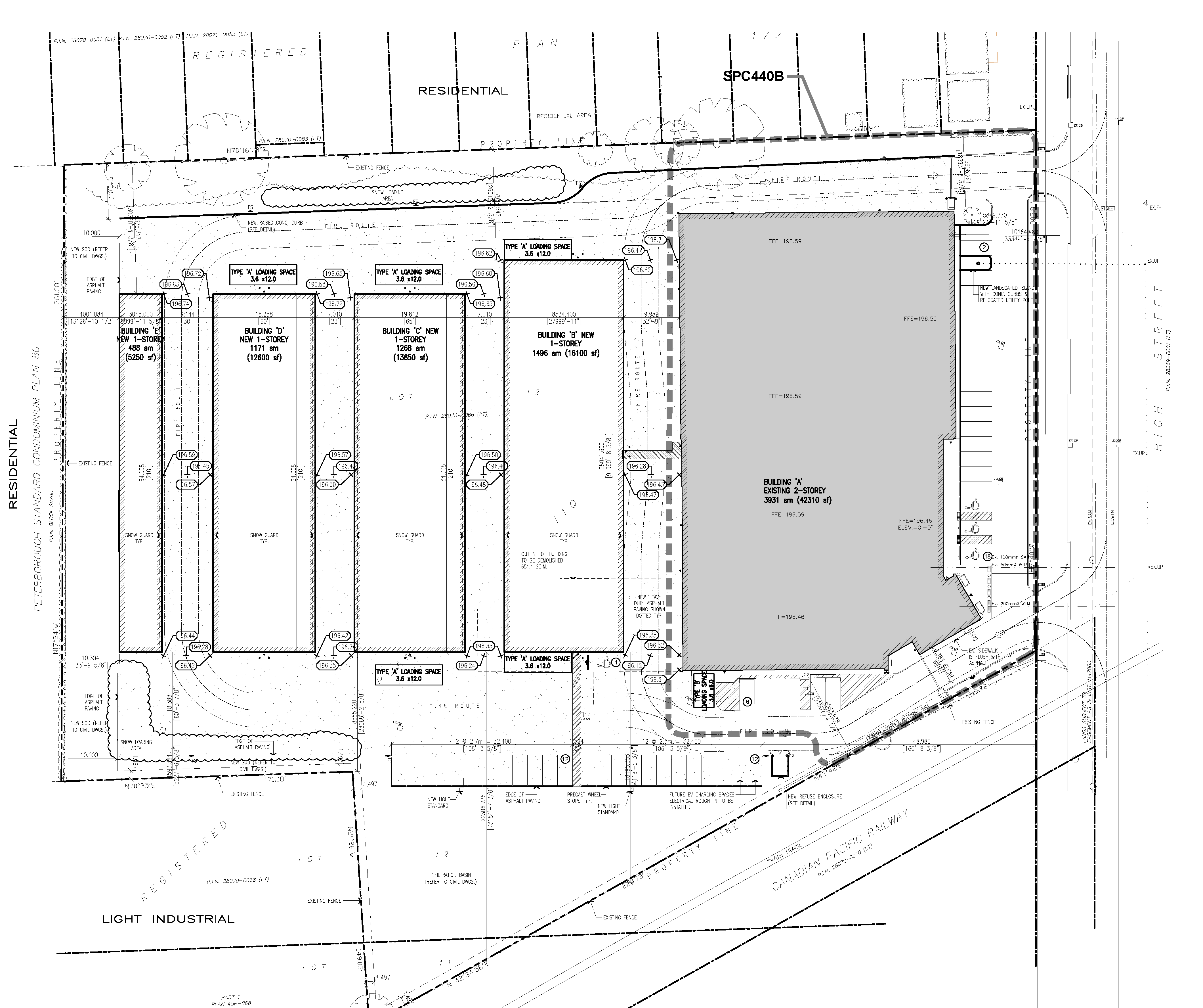Site Plan drawing includes an existing building and four smaller proposed buildings as well as parking lot, landscaping elements and traffic flows